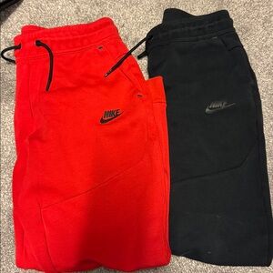 2 pairs Boys Nike tech fleece joggers in red and black - size youth large